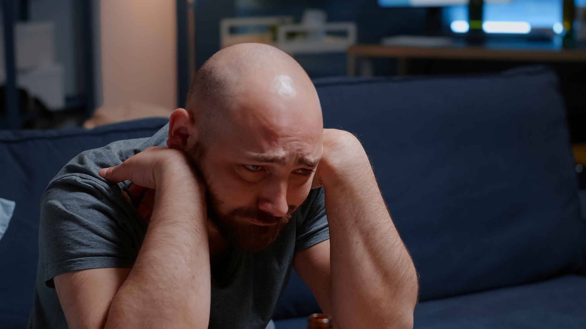 Close up of psychotic alone frustrated man staring into space with tears